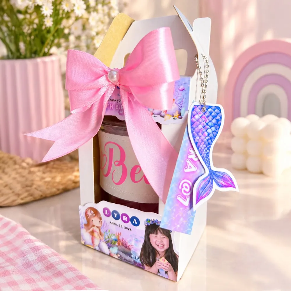 Personalized souvenir gift box with a pink satin bow and a mermaid keychain