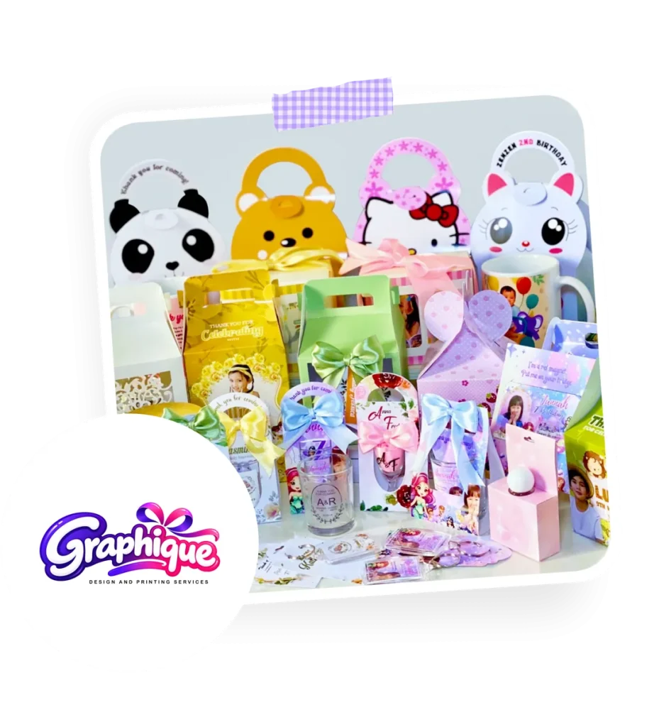 Graphique personalized souvenirs in colorful gift packaging: animal-shaped gable boxes, ribboned bags, mugs and tumblers